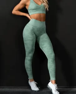 a girl wearing green color afordable gym wear outfit of gym
