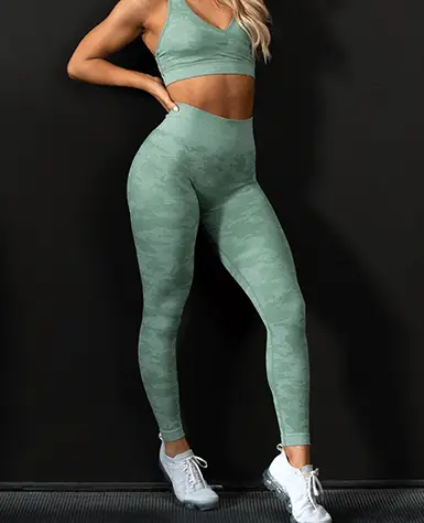 a girl wearing green color outfit of gym