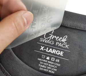 A black gym shirt displayed with custom labels : size, brand, and product details visible