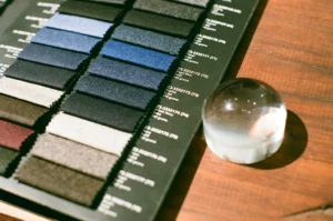 Polyester vs cotton fabric swatches displayed in an apparel material selection setting